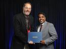 ARRL Electromagnetic Compatibility (EMC) Committee member Gerald J. Ramie, KI6LGY (left), received the Laurence G. Cumming Award for Outstanding Service on August 4, 2022. The award was presented by the Institute of Electrical and Electronics Engineers (IEEE) EMC Society President Vignesh Rajamani (right) of Element Materials.